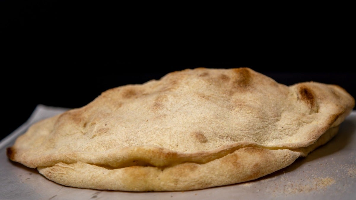 Calzone con prosciutto cotto e funghi champignon