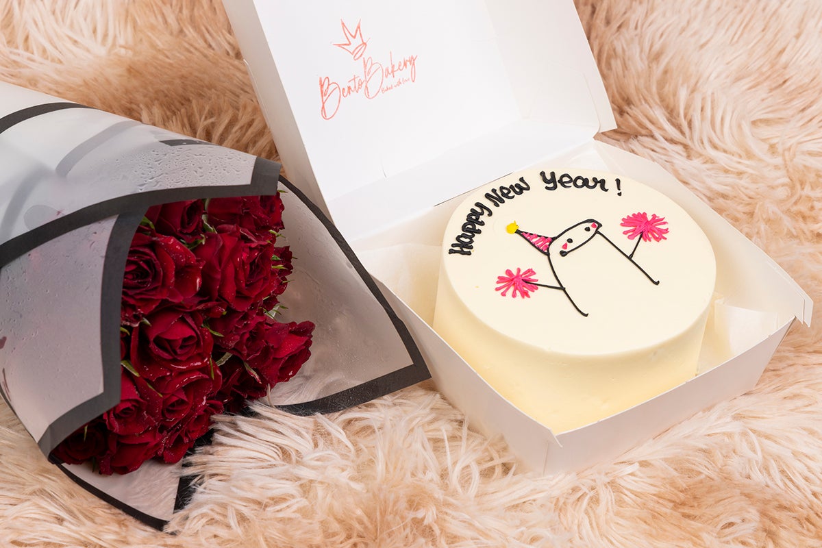 Pink Sparkile Hold New Year Cake with Flowers