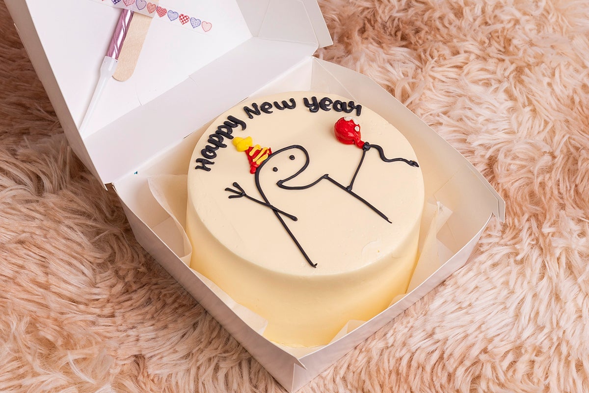 Holding Baloon Happy New Year Cake