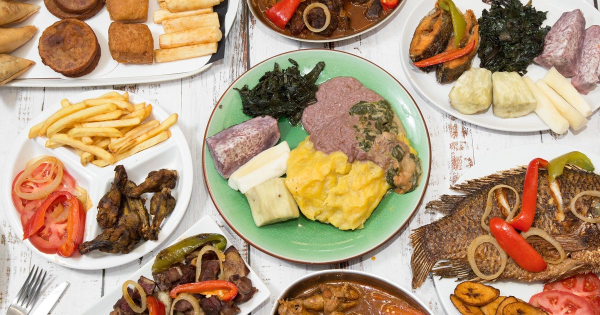 Uganda Food Guide 9 Ugandan meal spread with fish, matooke, vegetables and other accompaniments