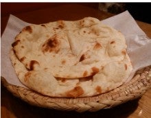 two pieces of tanoor bread
