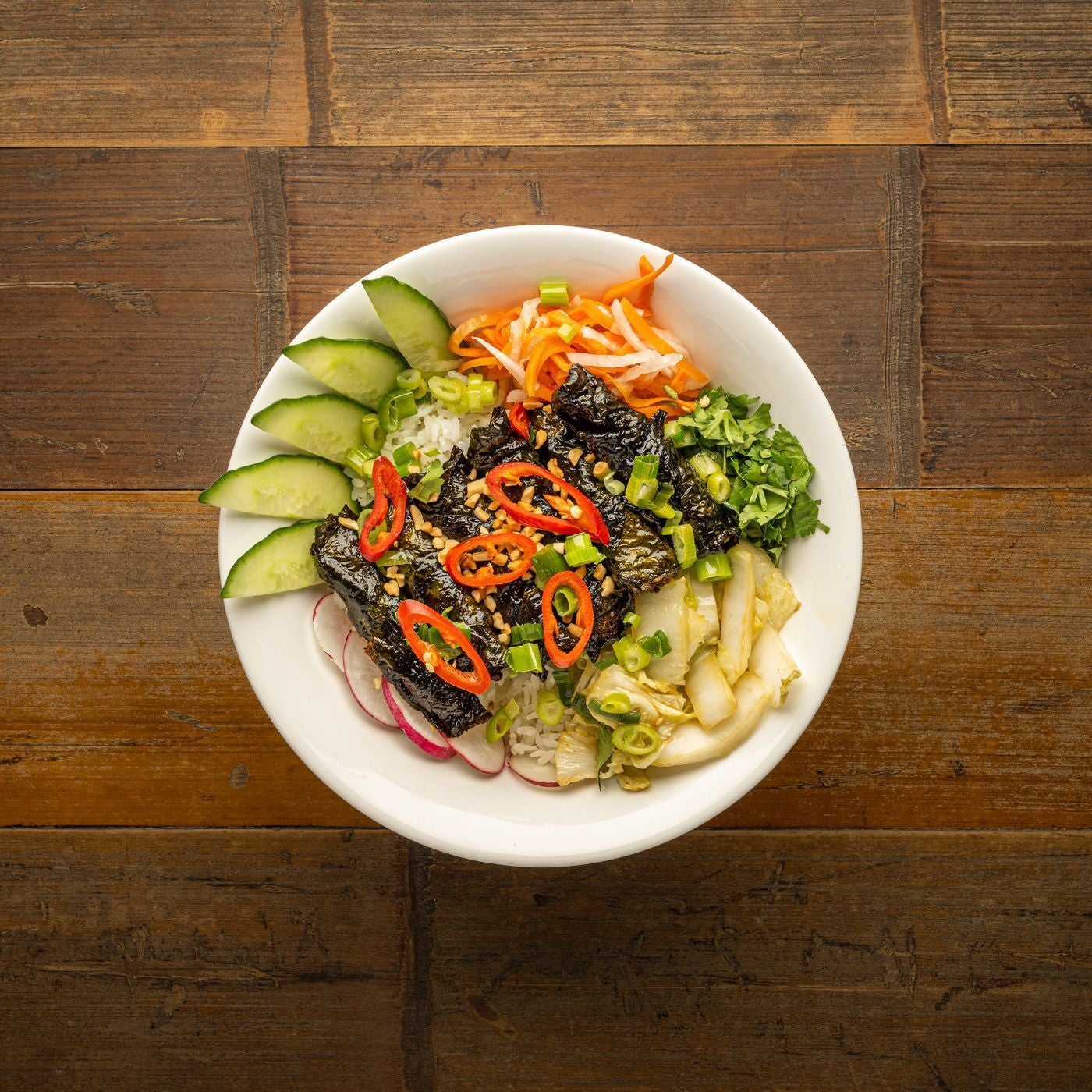 Crispy beef in betel leaf rice bowl